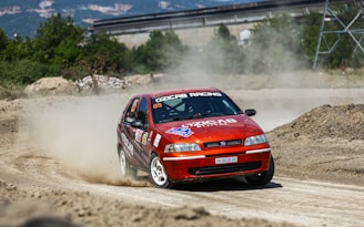 A close-up of a cartoon-style racing game featuring quirky characters competing on a dirt track.