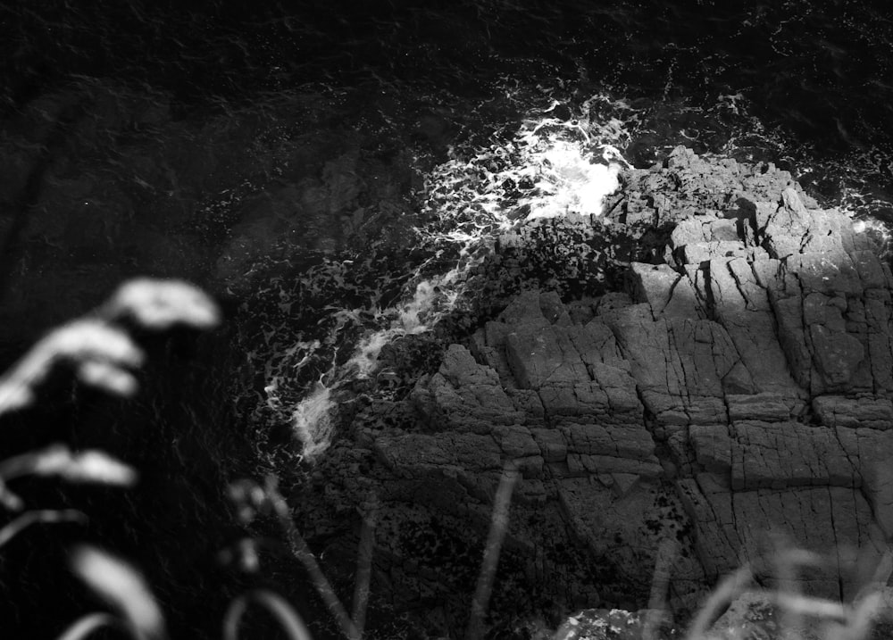 a black and white photo of a rock outcropping