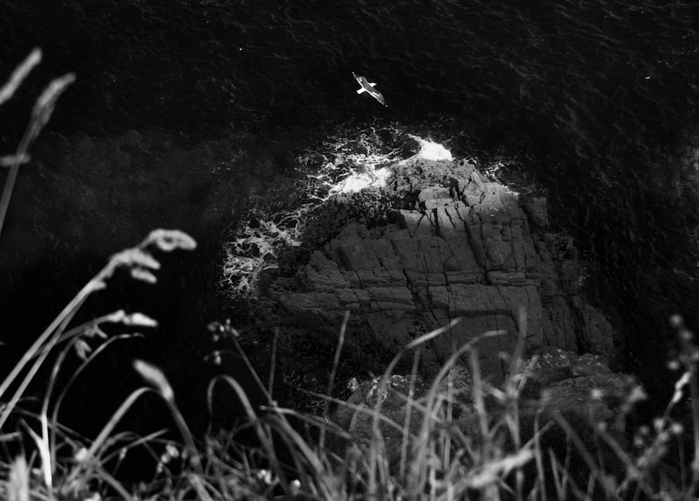 a black and white photo of a rock outcropping