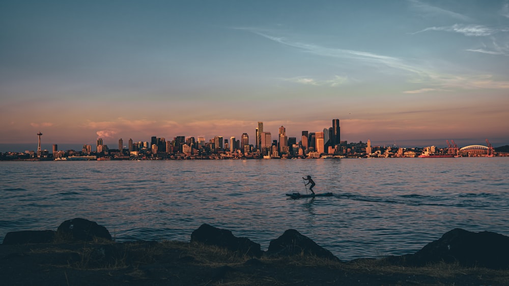 a person riding a surf board on a body of water