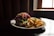 A plate of food featuring a sandwich loaded with various toppings, including purple cabbage and leafy greens, is accompanied by a generous serving of golden-brown fries. The setting appears to have minimal lighting, with a warm, moody atmosphere created by the dark background and a window on the side letting in some light.