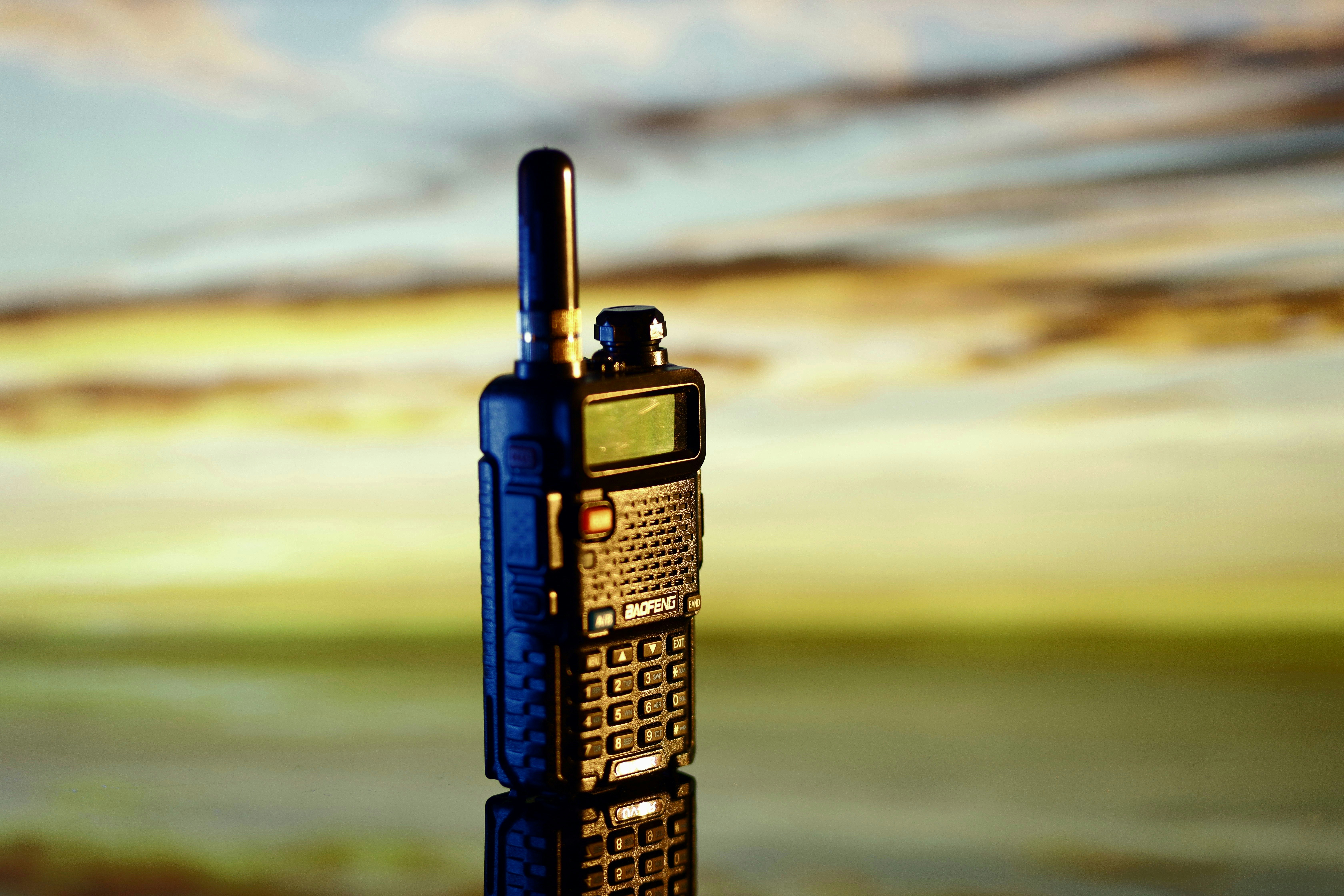 a cell phone sitting on top of a wooden table