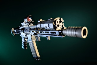 A detailed image of a modern assault rifle with visible attachments of Force Reset Triggers
