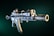 A detailed image of a modern assault rifle with visible attachments, including a scope and a tactical grip. The rifle is positioned at an angle against a dark green background, highlighting its metallic and precision-engineered parts.