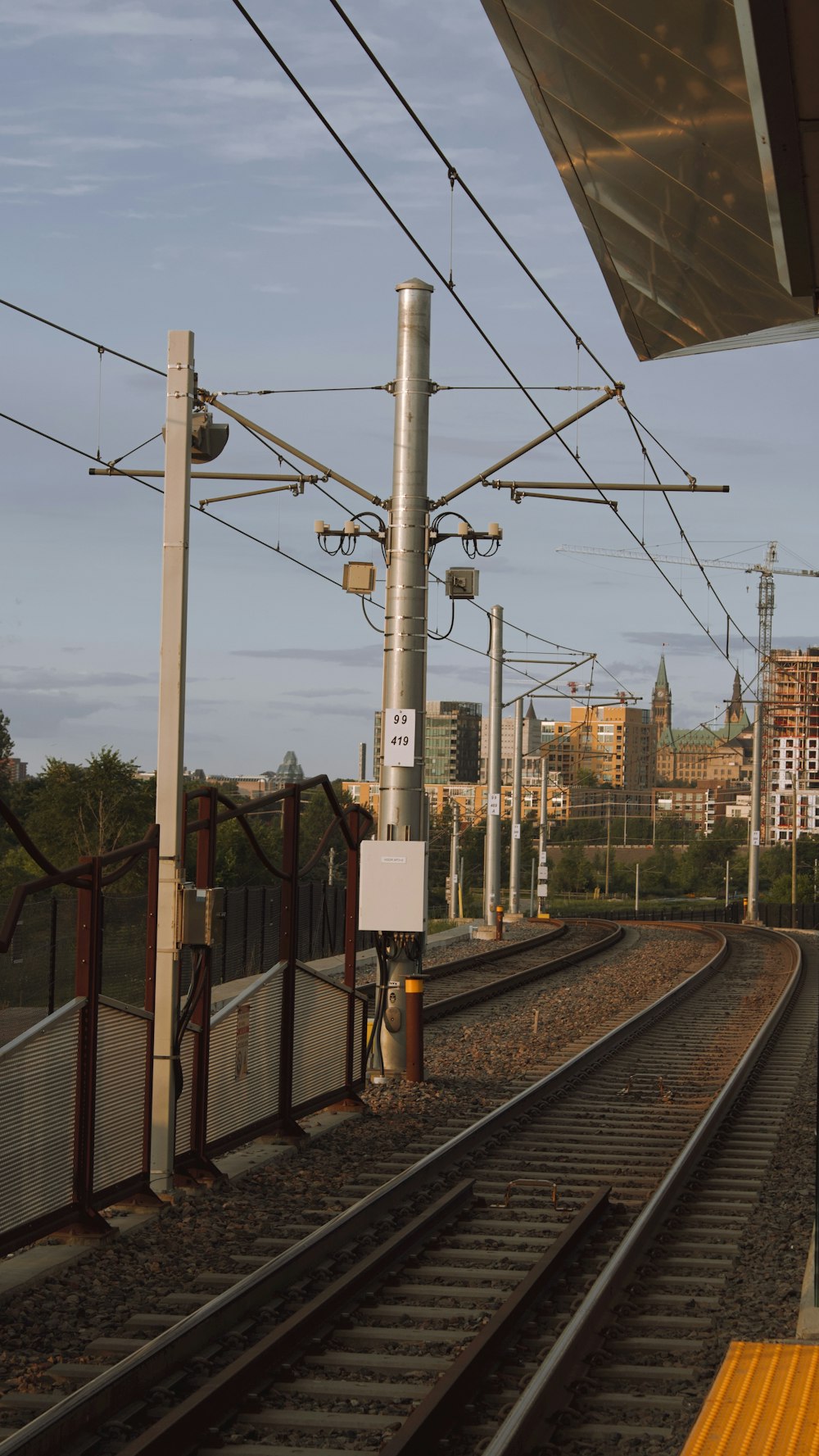 a train station with a train on the tracks