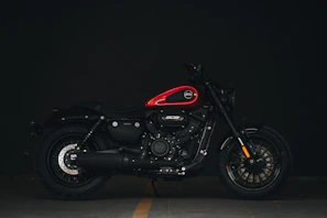 A compact motorcycle battery with a sleek design against a dark background.