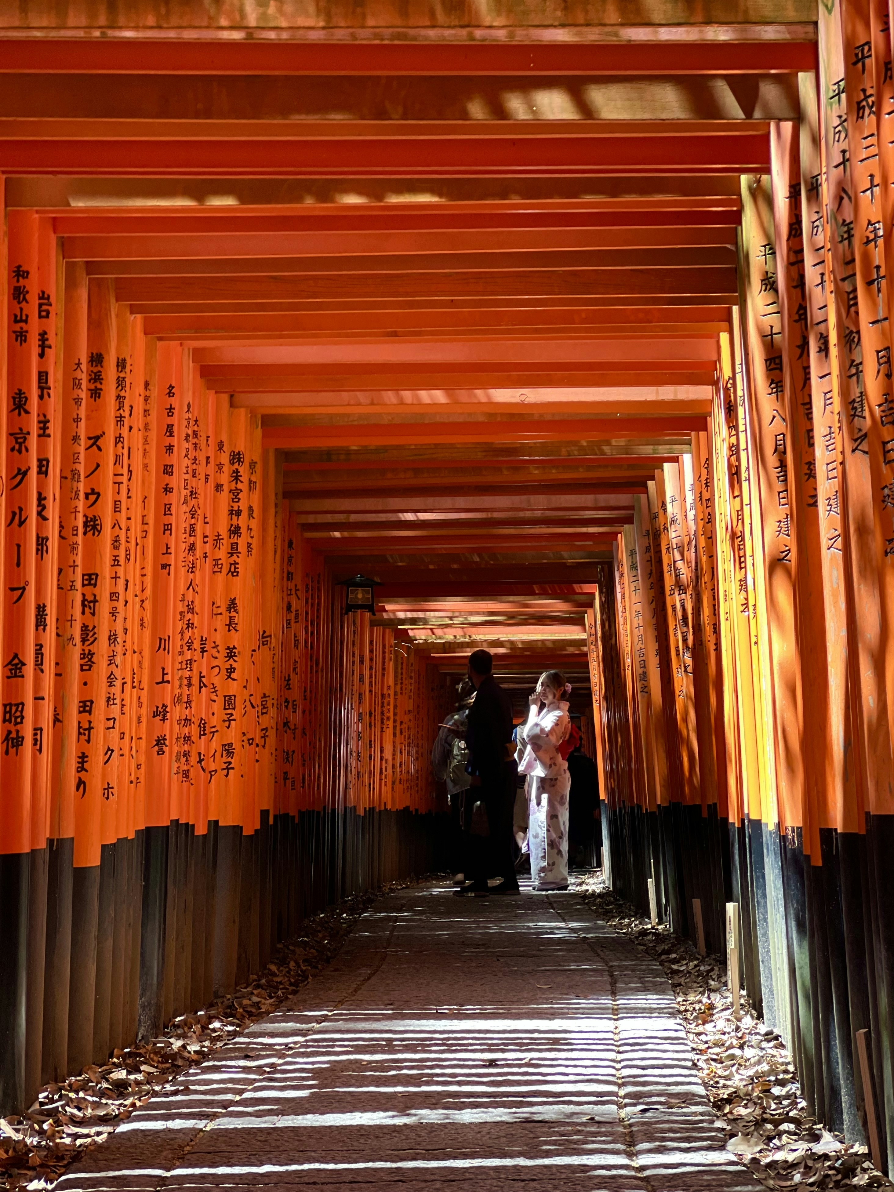 a group of people walking down a long tunnel