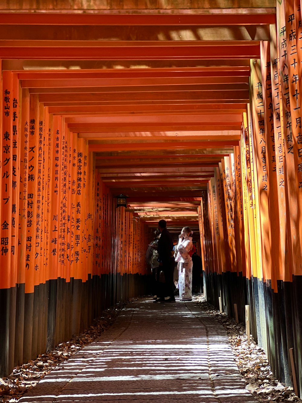 a group of people walking down a long tunnel