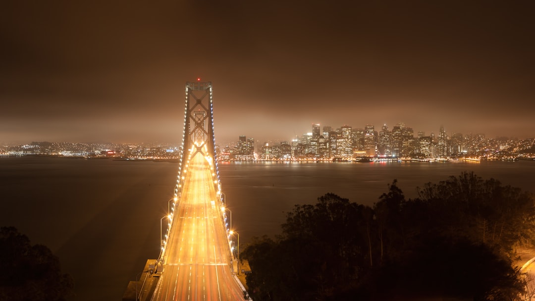 a night time view of the golden gate bridge, Bay Bridge And San Francisco At Night From Treasure Island 2012