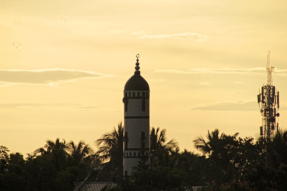 a tall tower with a clock on top of it