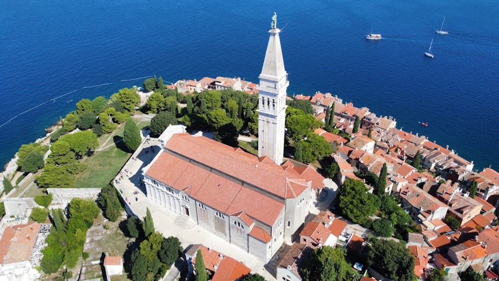 an aerial view of a small town with a steeple