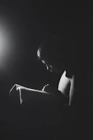A young adult reading aloud passionately during an online community reading event.