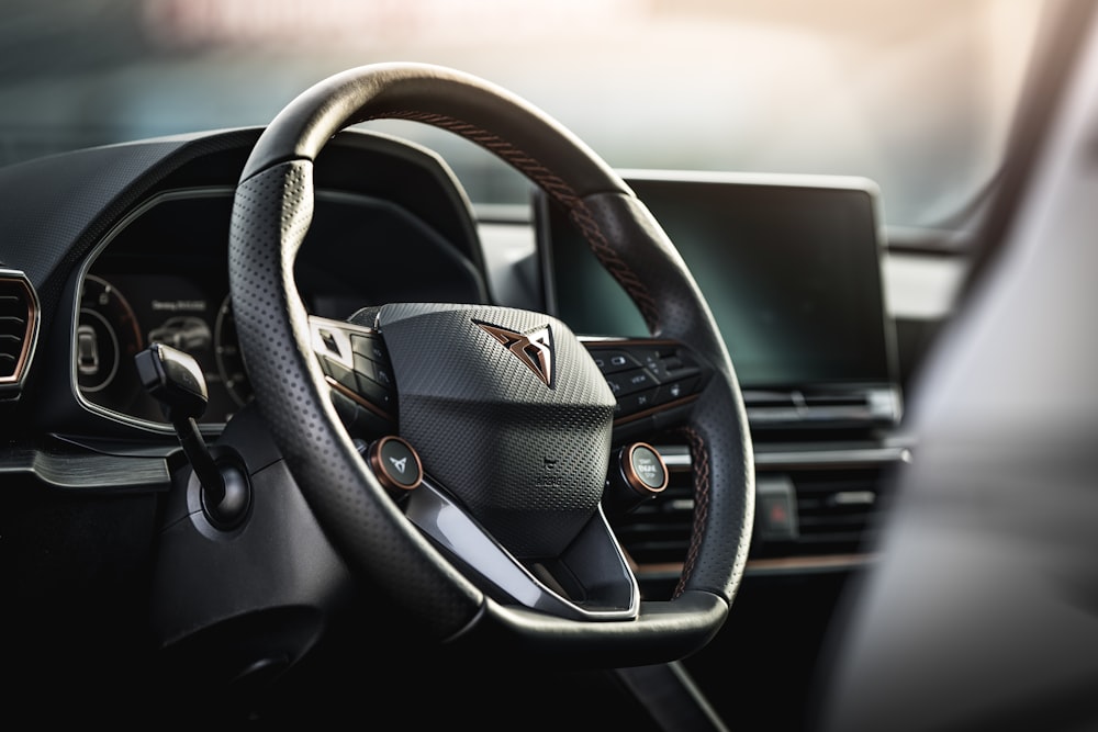 a steering wheel and dashboard of a car