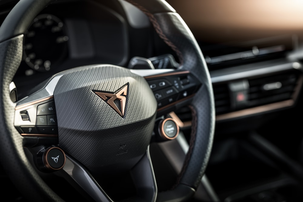 a close up of a steering wheel of a car