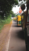 A fleet of e-rickshaws powered by itarang lithium batteries lined up in a bustling tier-2 city street.