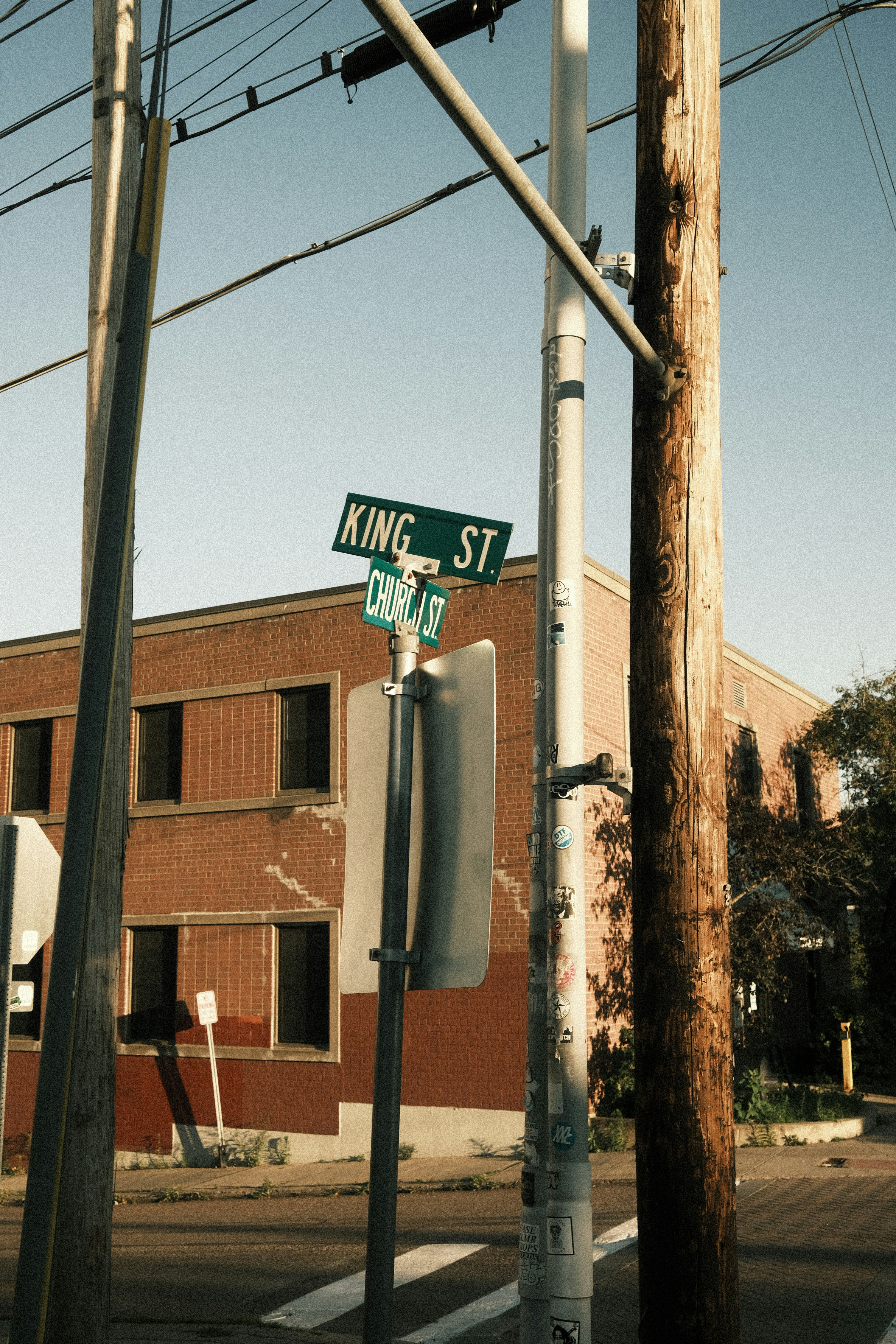 a street sign on a pole in front of a building