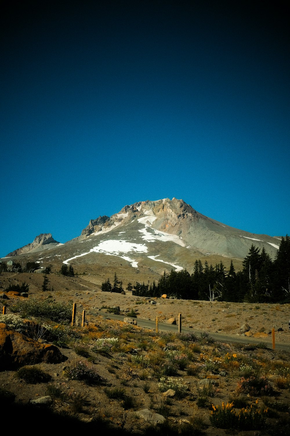 a mountain with a snow covered peak in the distance