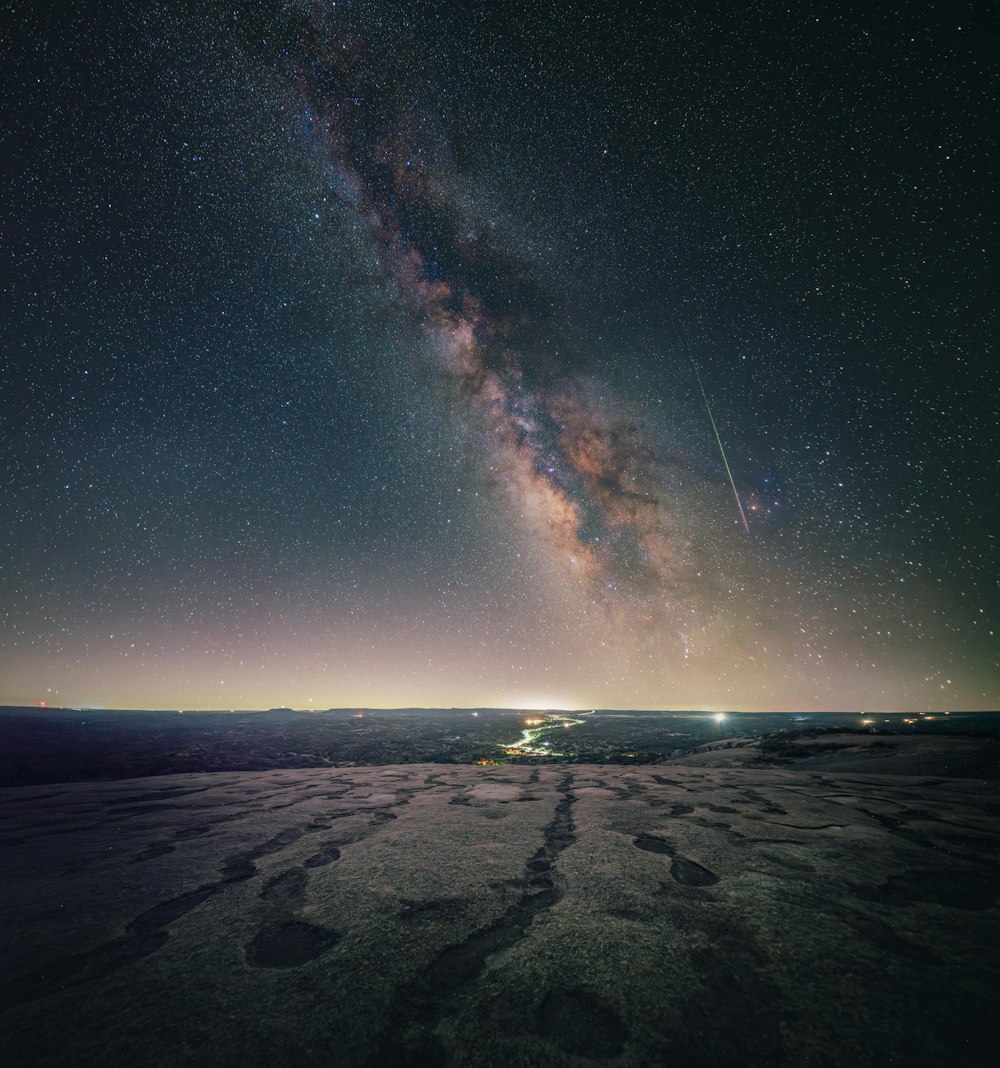 a view of the night sky with the milky in the background