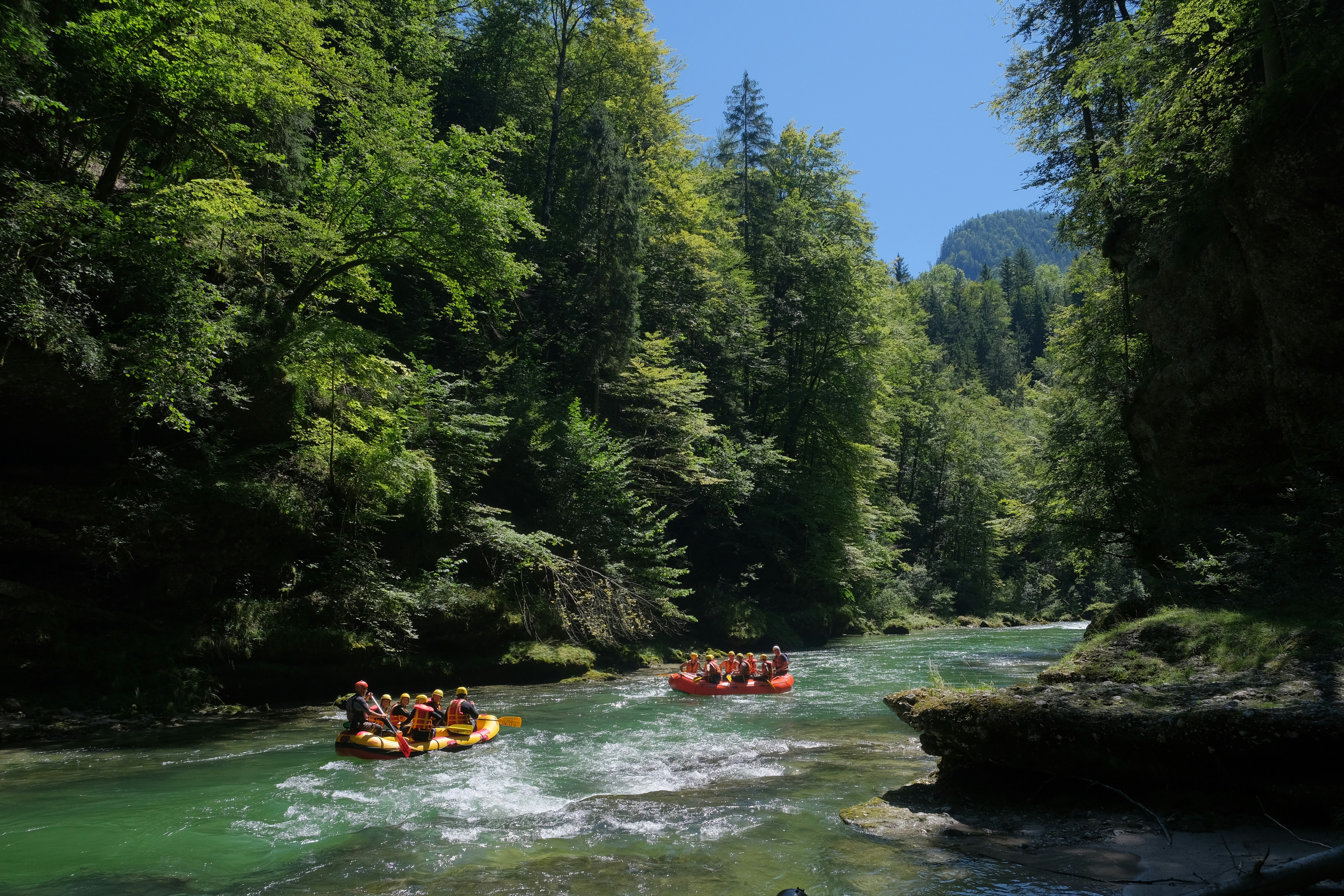 A group of people are rafting down a river photo – Free Austria Image ...