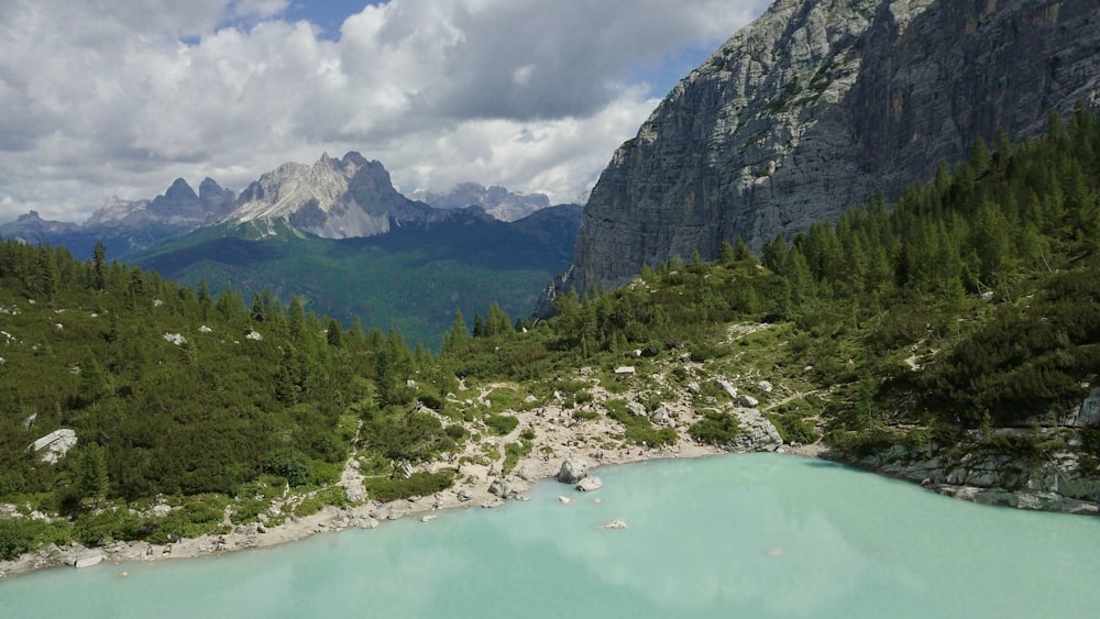 a blue lake surrounded by mountains and trees