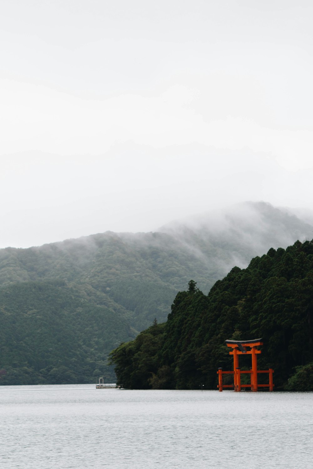 a large body of water with a red structure in the middle of it