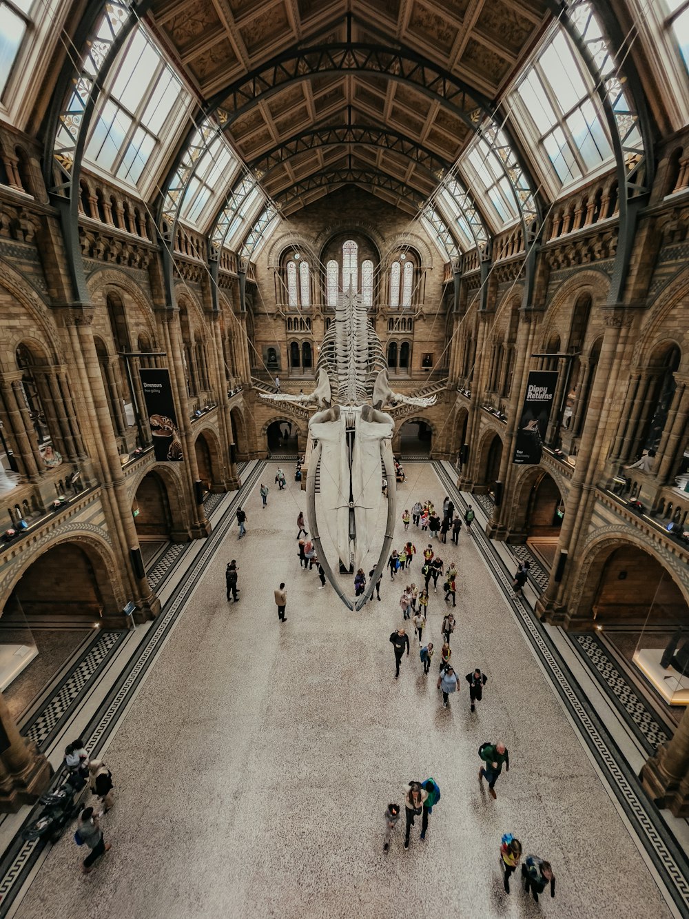 a group of people standing in a large building