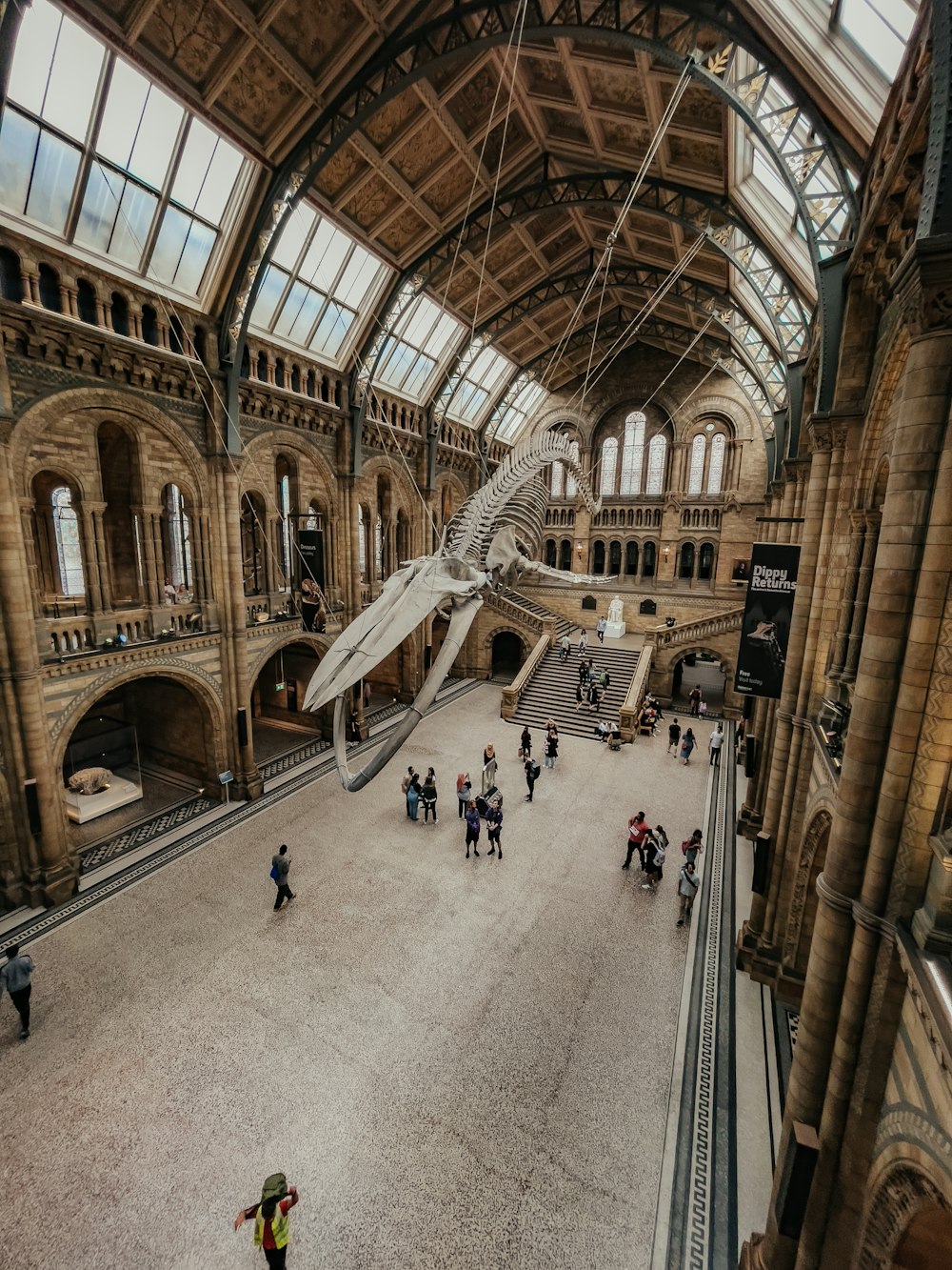 a group of people standing in a large building