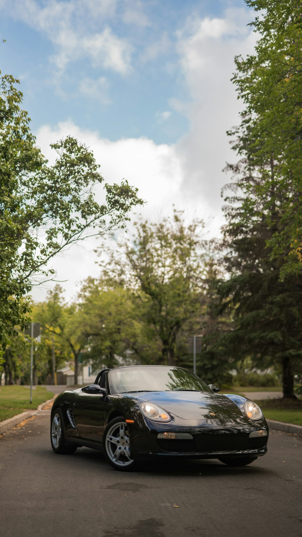 a black sports car parked on the side of the road