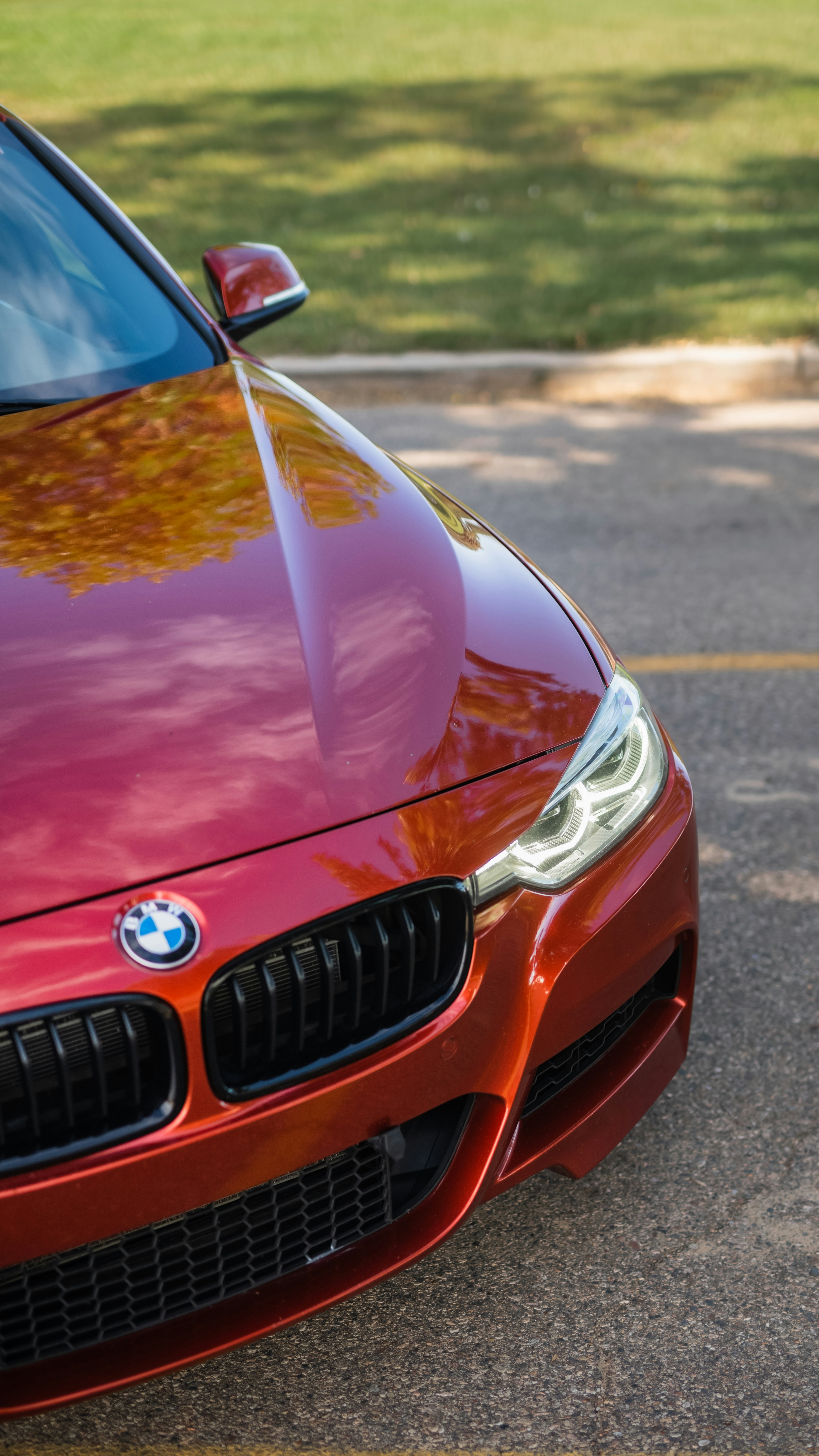 a close up of the front of a red car