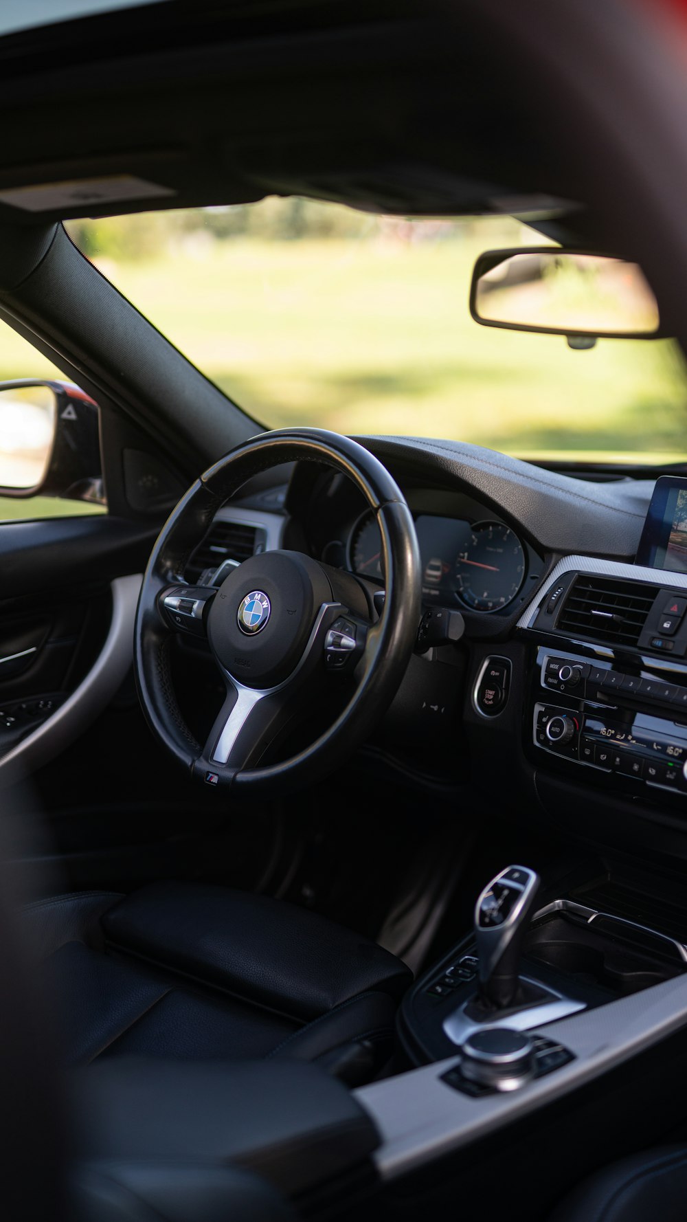 the interior of a car with a dash board and steering wheel