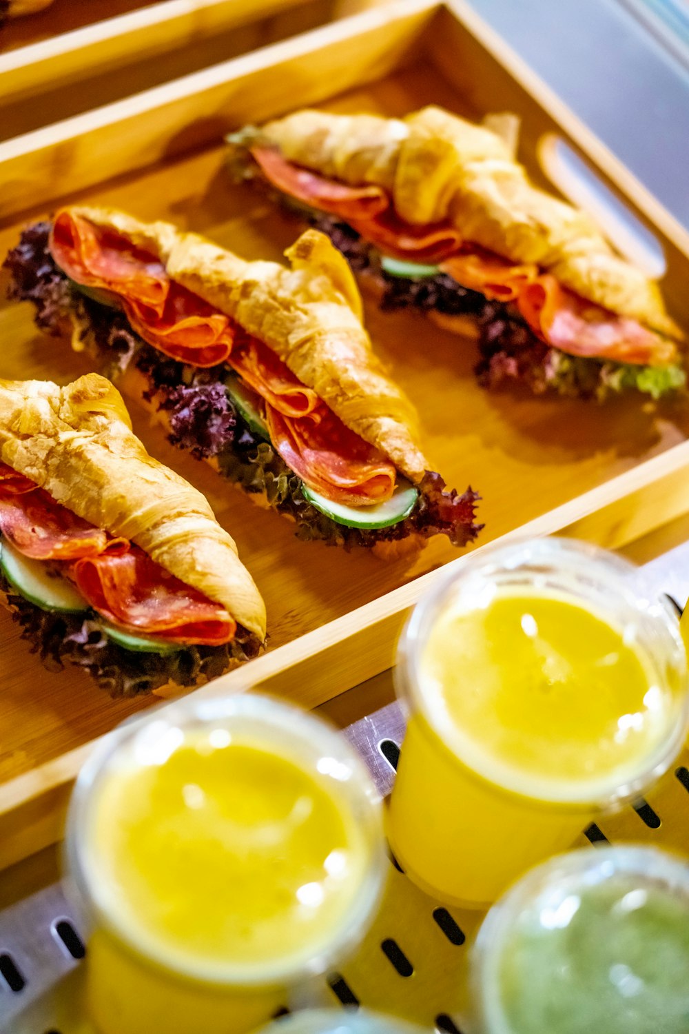 a tray with sandwiches and drinks on it