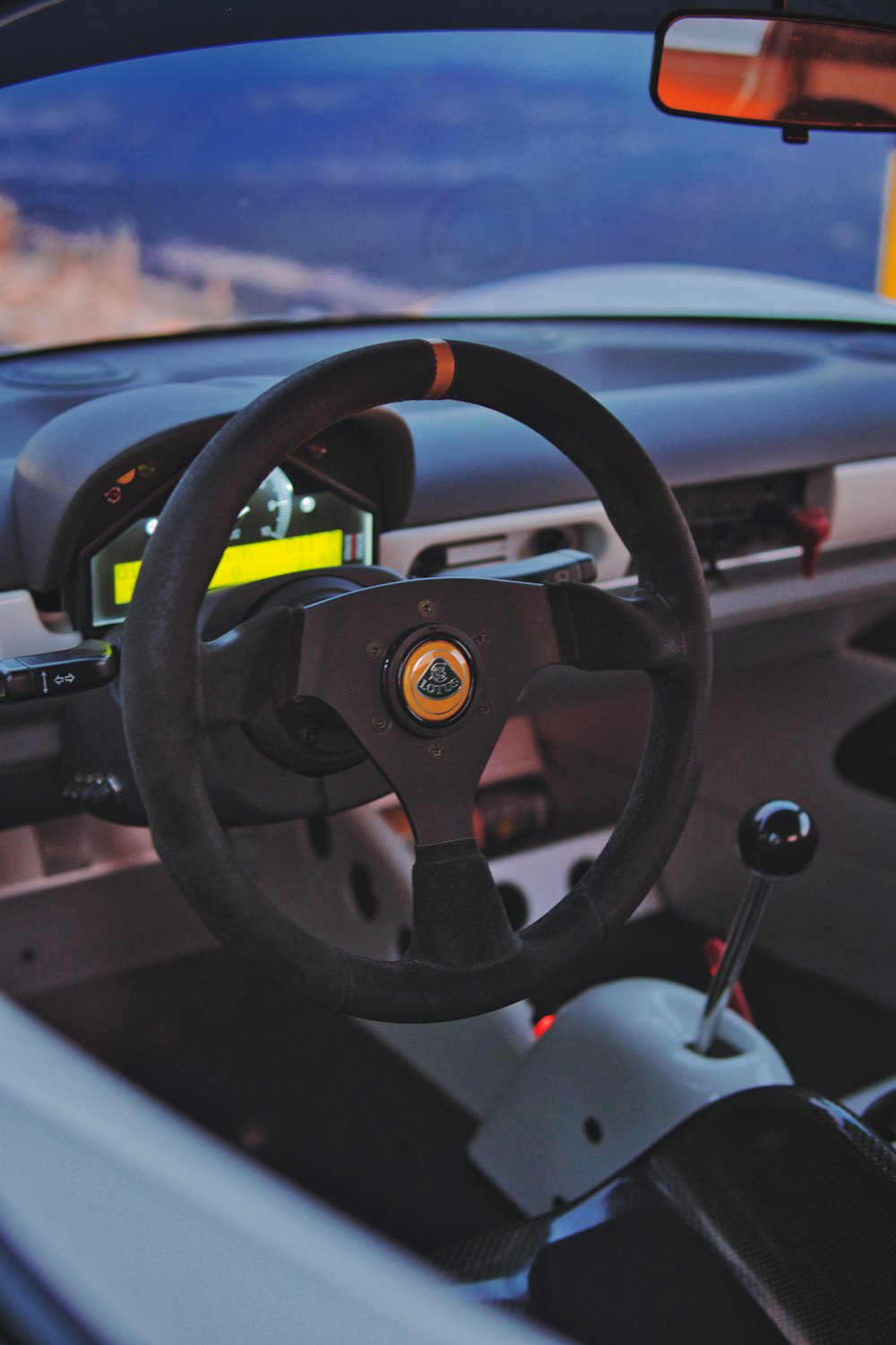 the interior of a car with a steering wheel