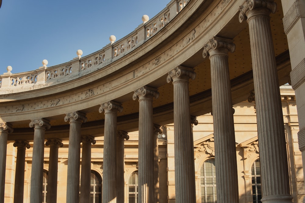 a circular building with columns and a clock