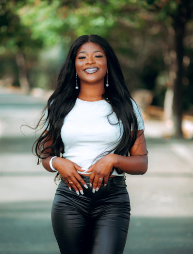 a woman in black pants and a white shirt