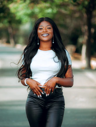 a woman in black pants and a white shirt
