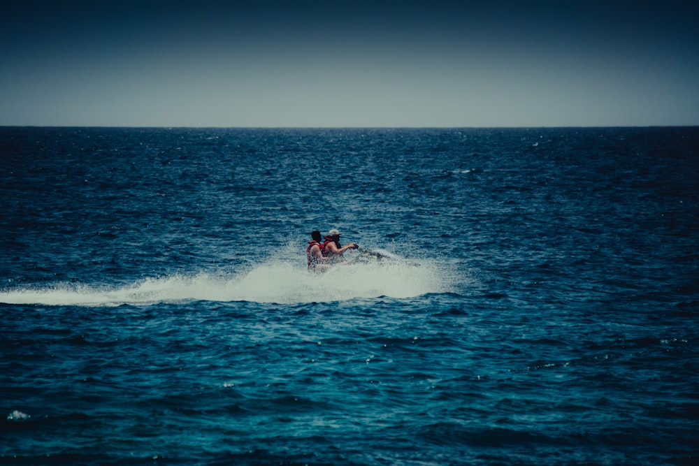 a person on a jet ski in the middle of the ocean
