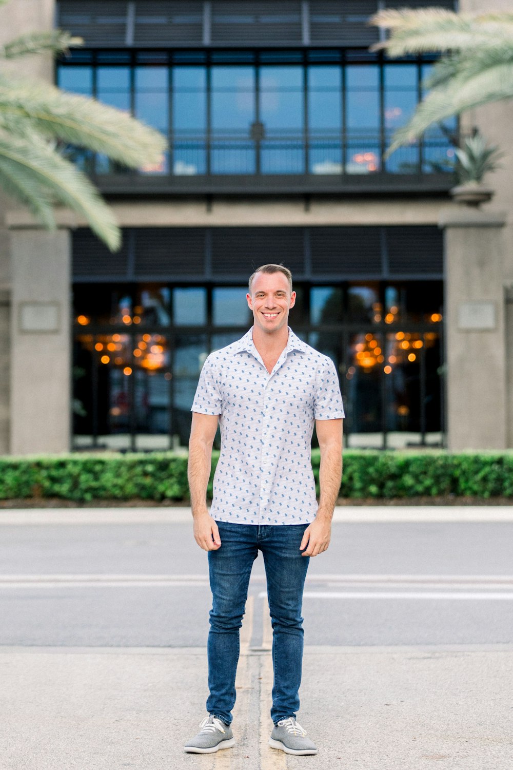 a man standing in front of a building