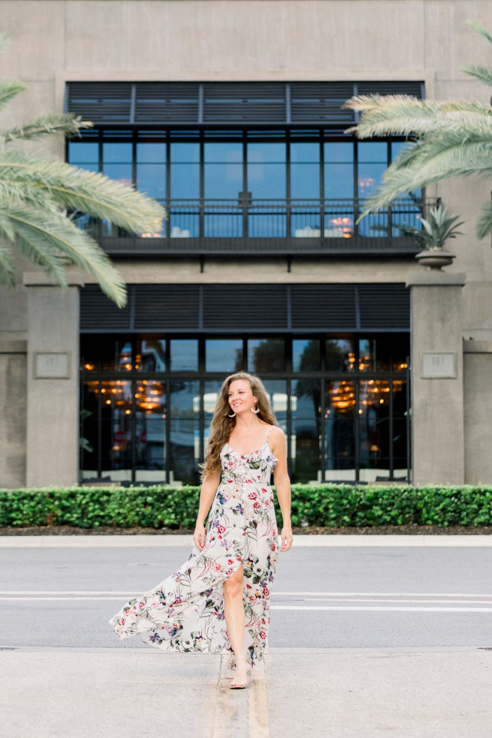 a woman standing in front of a building