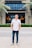 a man standing in front of a building