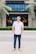 a man standing in front of a building