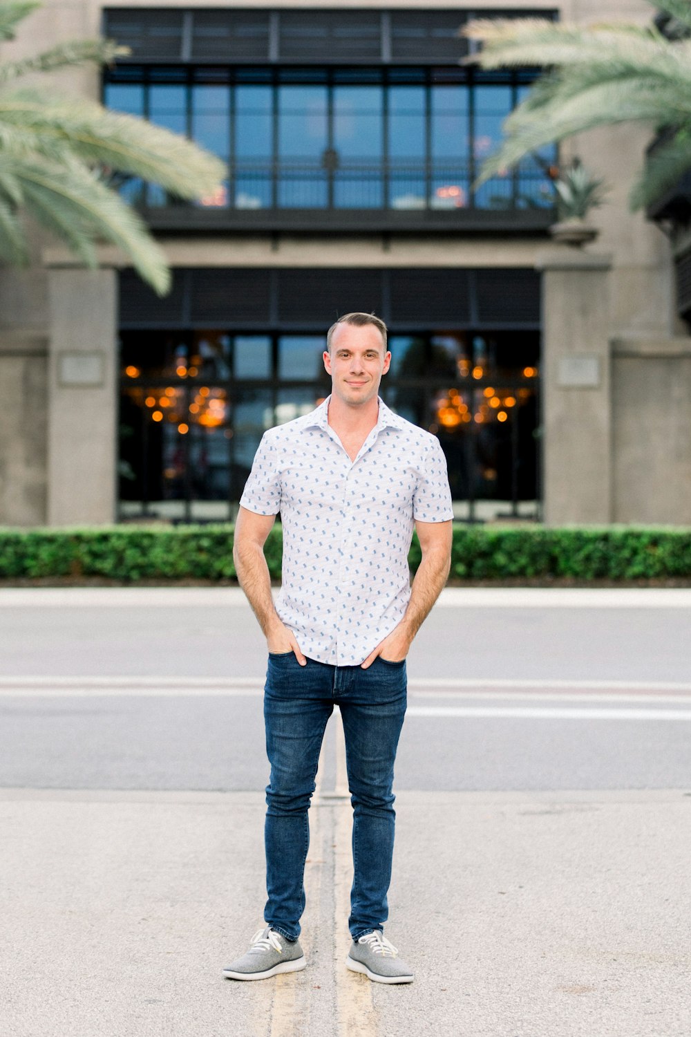 a man standing in front of a building