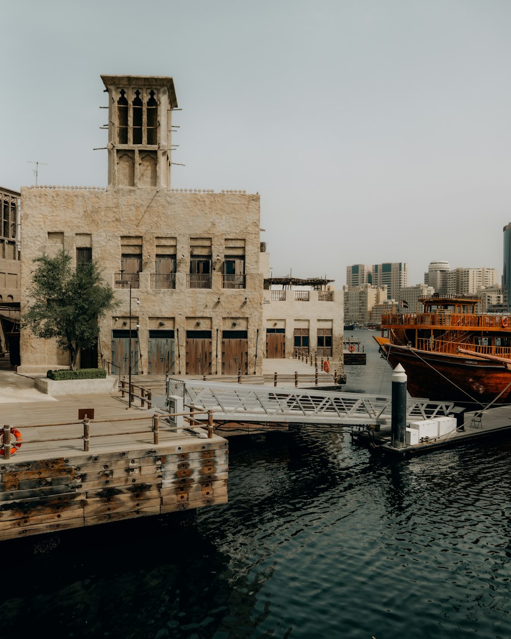 a boat docked in a harbor next to a building