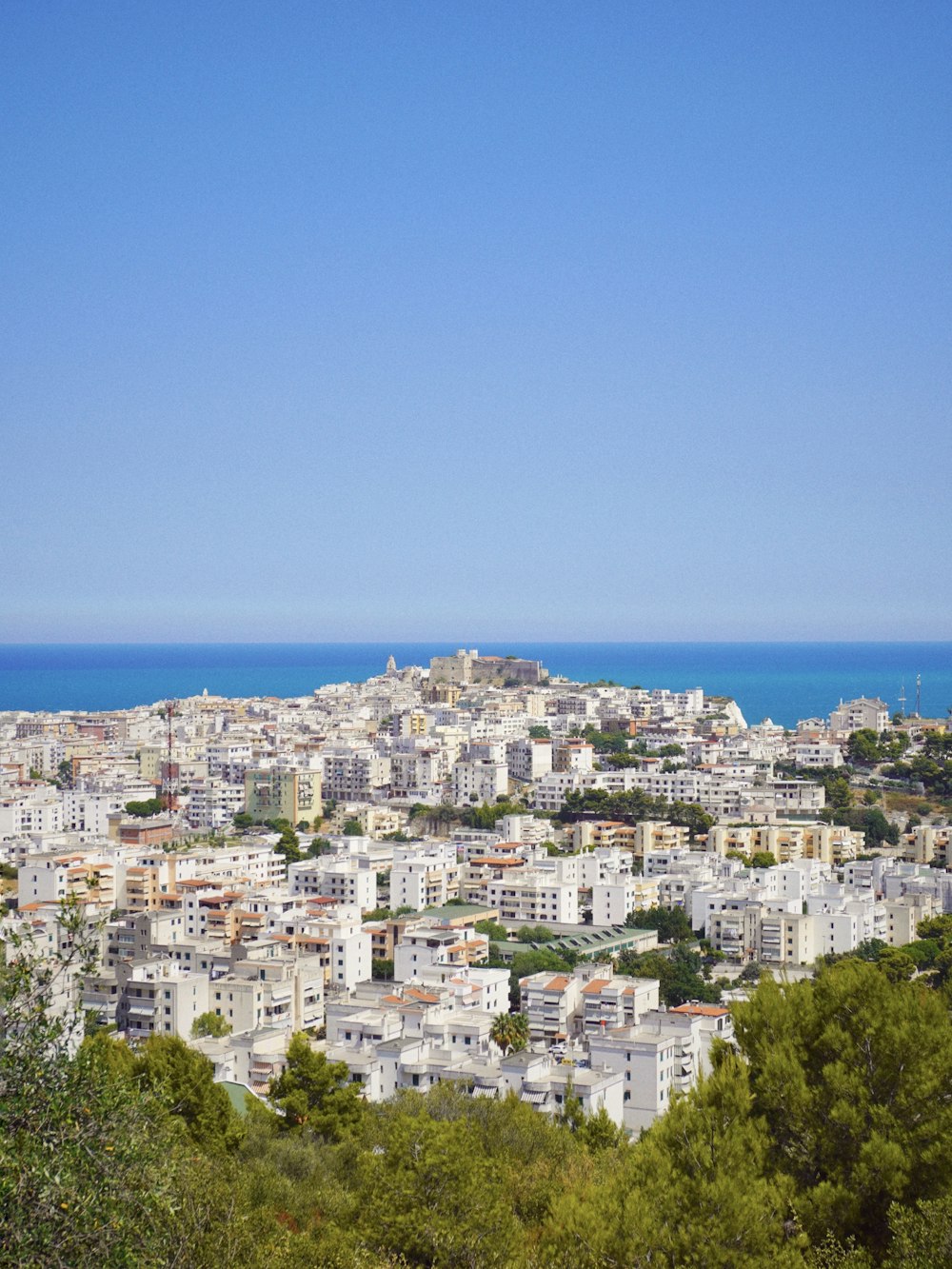 a view of a city from a hill