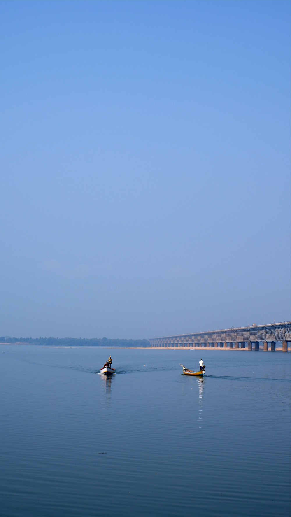 a person in a small boat on a large body of water