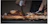 Close-up of a chef carefully using a digital thermometer on a sizzling steak.