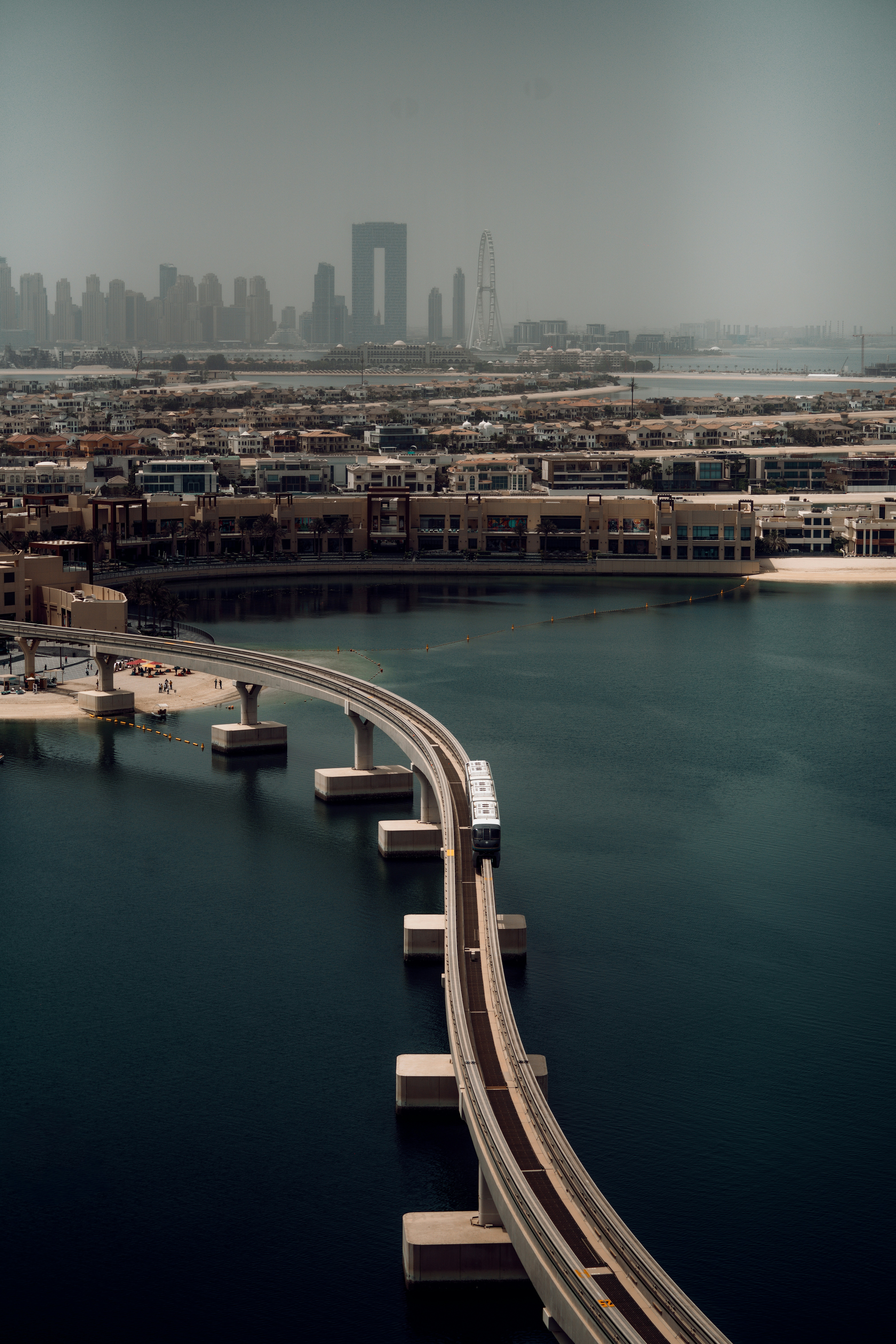 a train traveling over a bridge over a large body of water