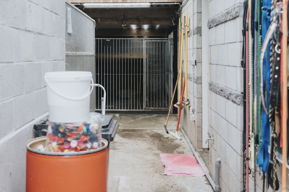 a storage area with a bucket of candy in it