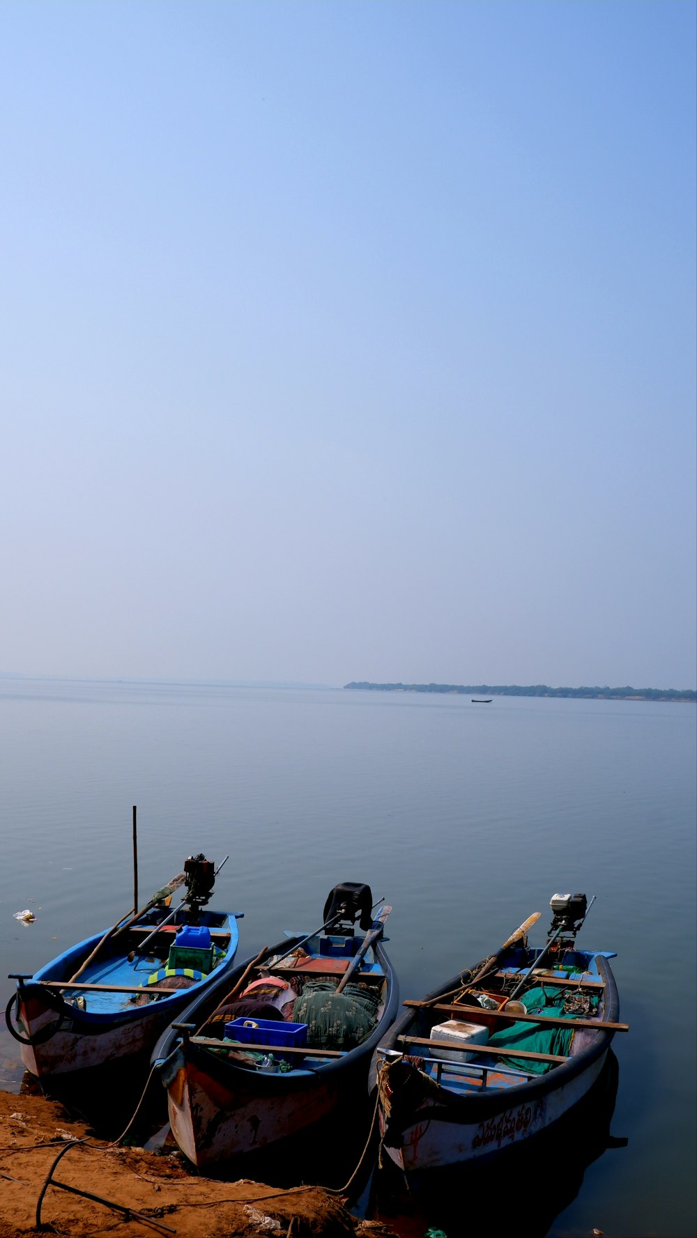 a couple of boats that are sitting in the water