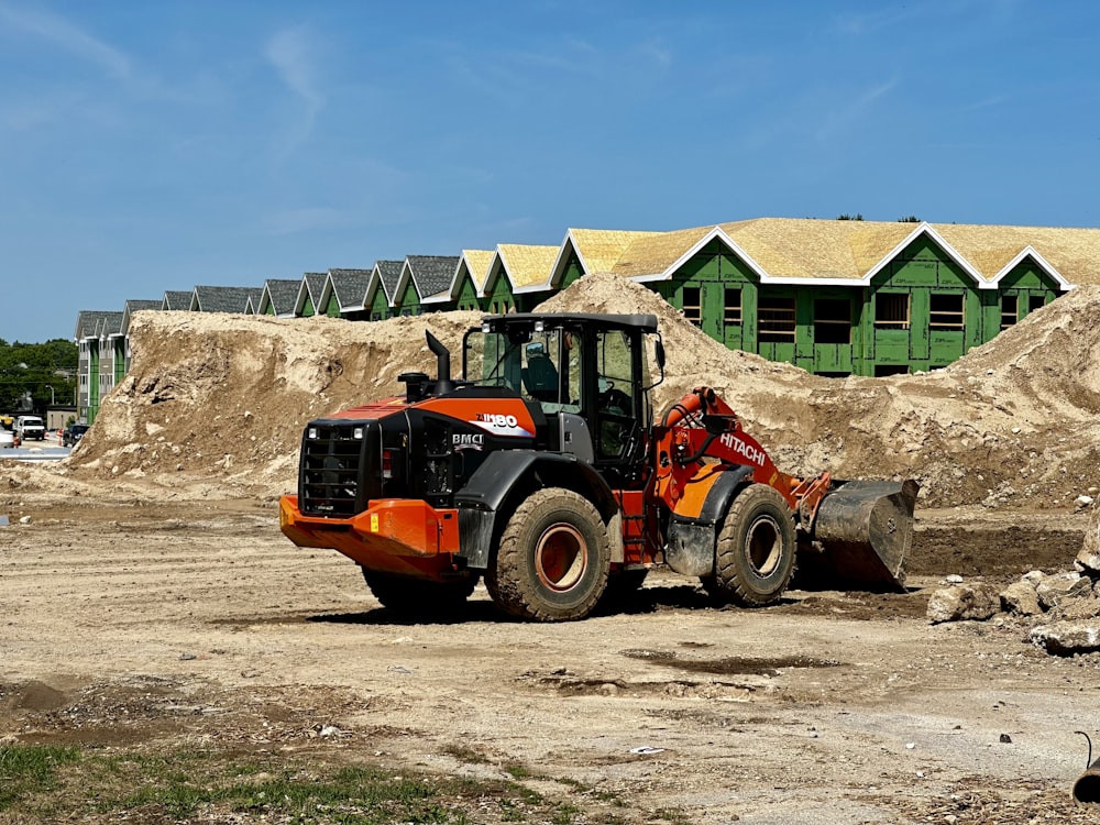 a tractor is parked in front of a construction site