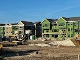 a row of houses under construction in a residential area